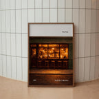 Framed photograph of a bar interior on a tiled wall